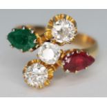 A diamond, emerald and ruby cluster ring in the suffragette colours featuring a central cushion