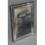 A hallmarked silver photo frame, height 25.5.cm.