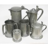 Two large 19th century pewter ale tankards, a smaller tankard, a jelly mould and a pair of loving