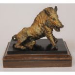 A gilt bronze study depicting a wild boar on ebonised and oak base, unmarked, height 23cm.