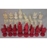 A 19th century Chinese puzzle ball ivory chess set, height of kings 14.5cm. Condition - red rooks