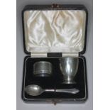 A cased Art Deco style hallmarked silver Christening set.