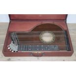 A rosewood zither with hard case circa 1900.