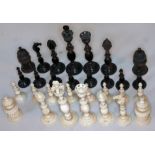 A 19th century Vizagapatam ivory and horn chess set, height of kings 12cm. Condition - two knights