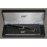 A Montblanc Meisterstuck ballpoint pen with box and service guide.