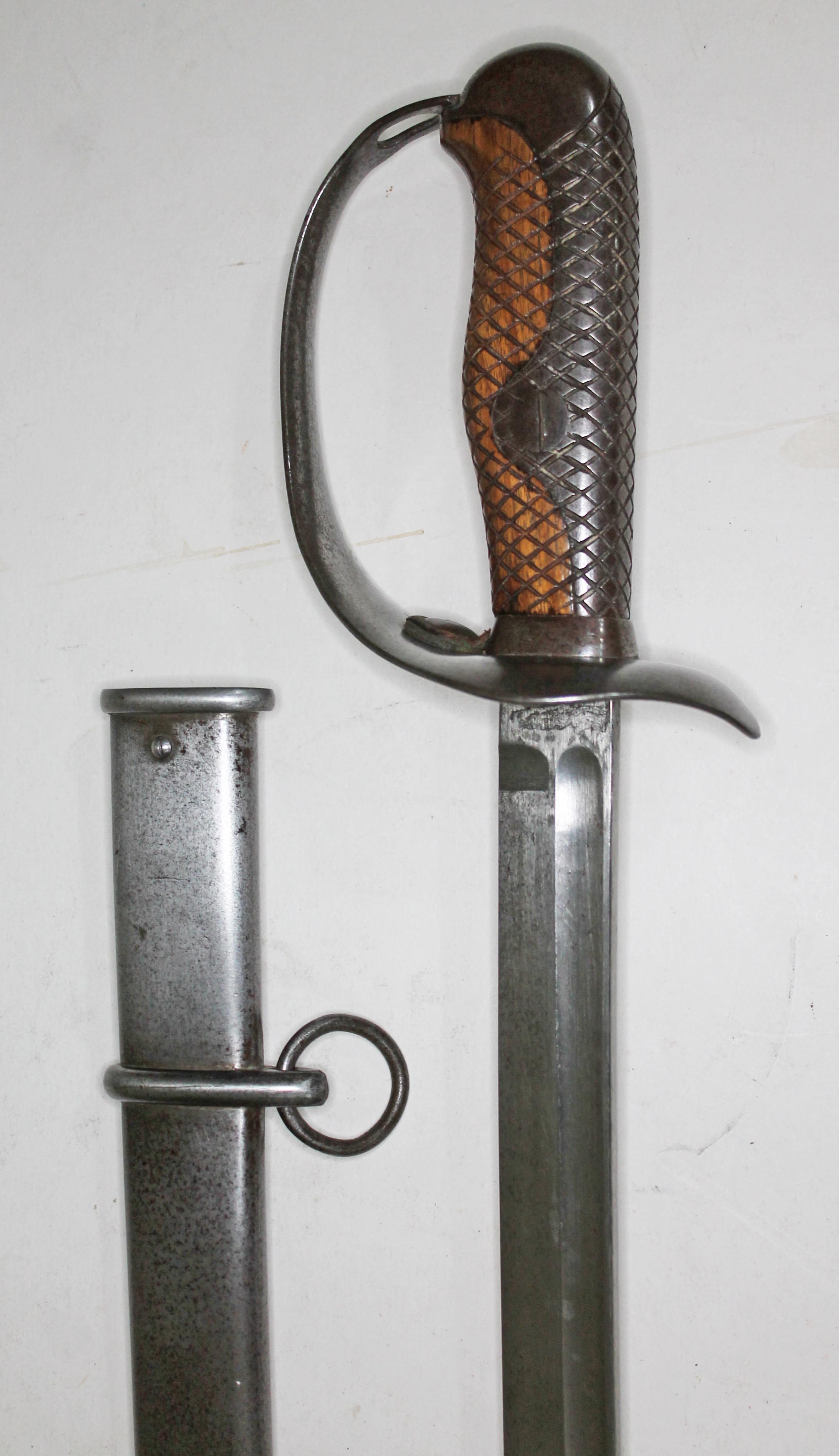 A 20th century eastern cavalry sword and scabbard, length 100cm.