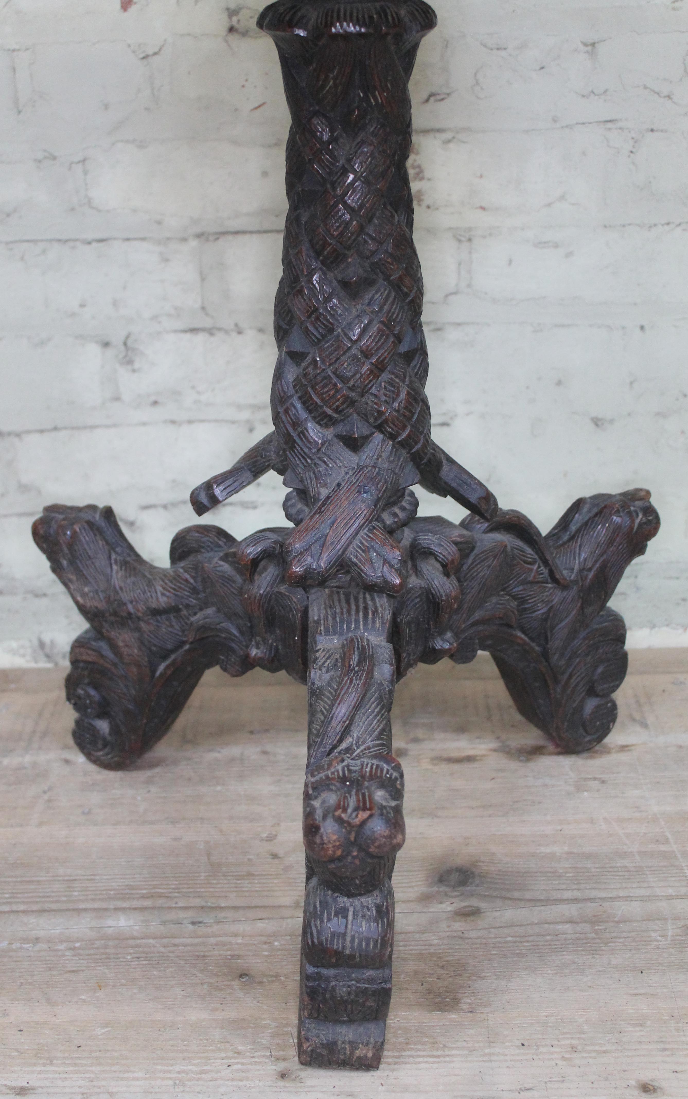 A 19th century Anglo-Indian rosewood tripod table with flip top and carved profusely with hunting - Image 5 of 6