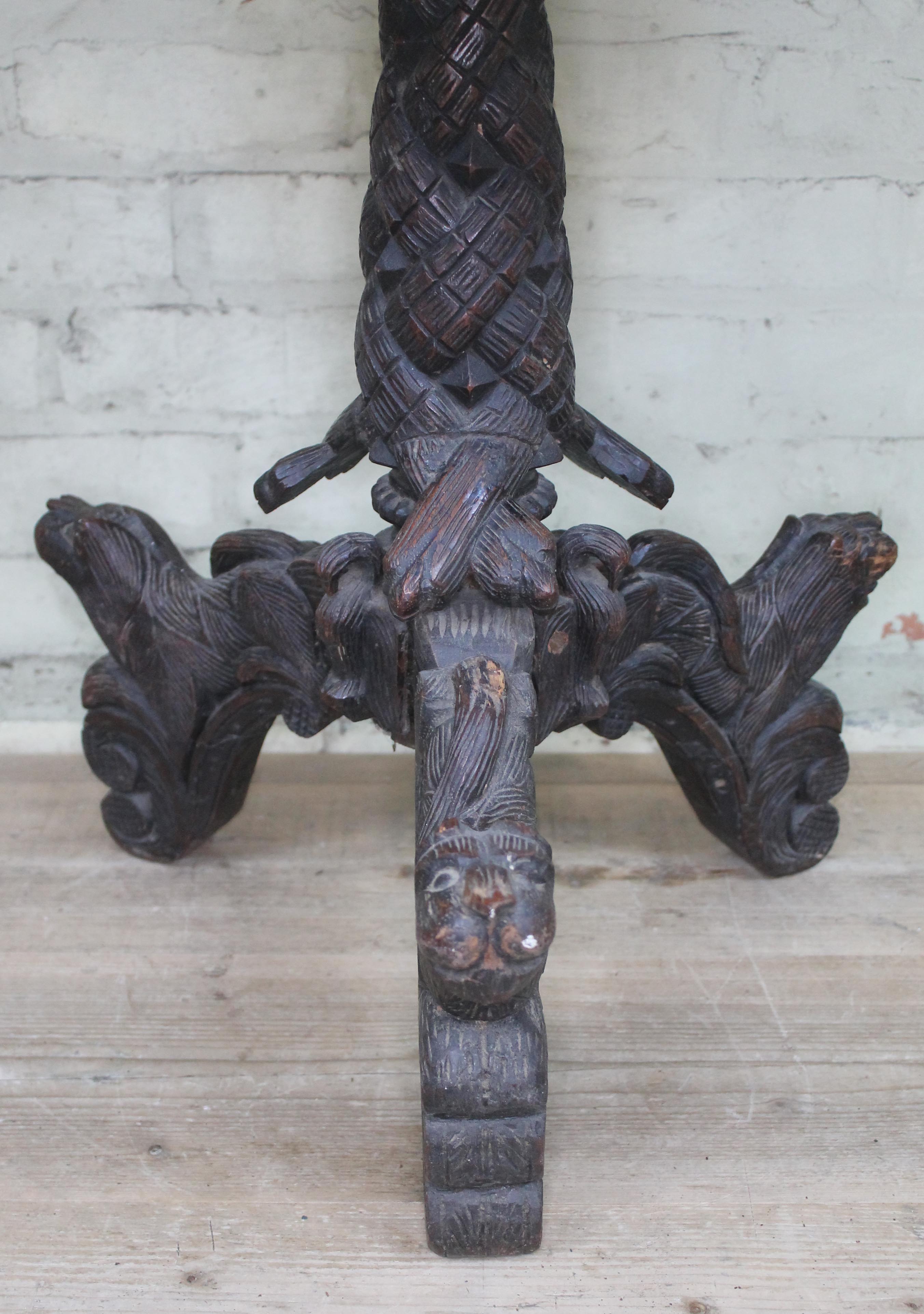 A 19th century Anglo-Indian rosewood tripod table with flip top and carved profusely with hunting - Image 3 of 6