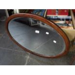 An oval inlaid mirror