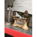 Cast metal cream painted weighing scales with green painted tray and weights and 2 vintage storm