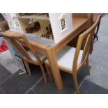 A Winsor modern light oak extending dining table with 4 chairs