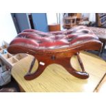 A Chesterfield style X frame foot stool