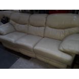 A 3 piece cream leather reclining suite
