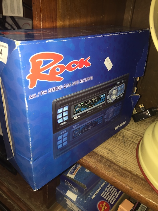 A boxed Rock MP 9030 car music player radio