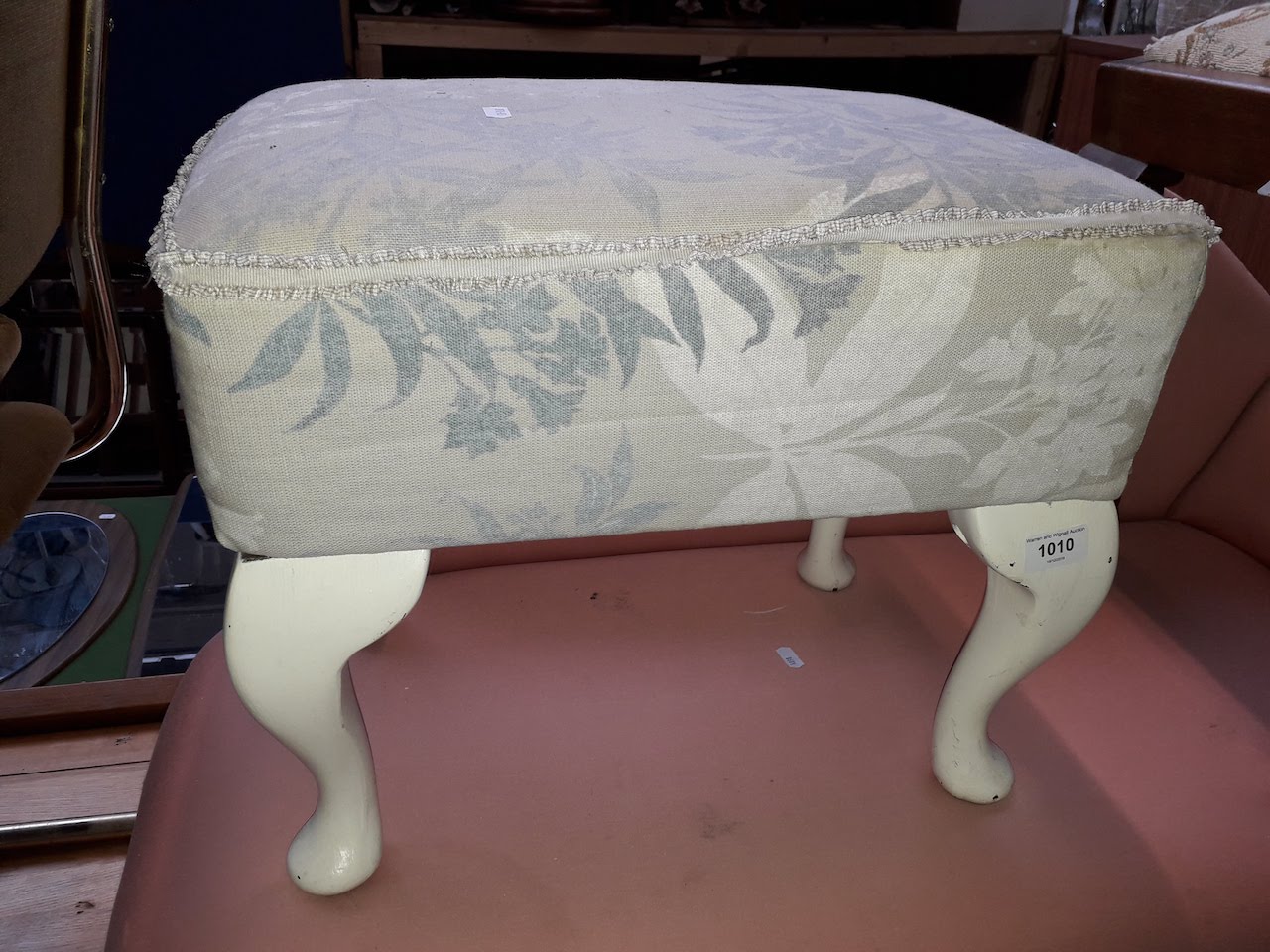 An upholstered foot stool
