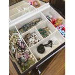 A jewellery case containing costume jewellery