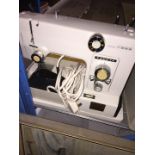 Toyota Model 5000 sewing machine in original case, with pedal and lead.