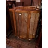 A bow front glazed display cabinet