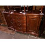 A reproduction mahogany bow front sideboard