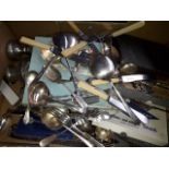 A box of plated cutlery and other items