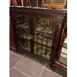 A mahogany 1920s glazed bookcase cabinet with felt lined shelves.