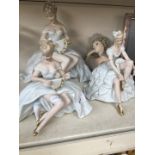 Three Continental porcelain figures of ladies and a composition one