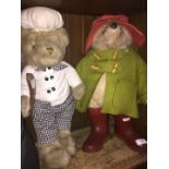 A vintage Paddington Bear soft toy and a cook bear.