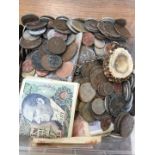 A box of world coins and banknotes.