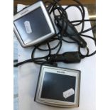 2 TomTom satnavs, model numbers : TomTom One N14644 and TomTom One 3rd edition with cables and in