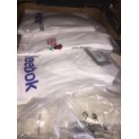 A box of mixed sports shirts including Reebok