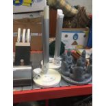 A candlestick holder in shape of Budhist figures forming a circle, pair of Taotronics LED desk lamps