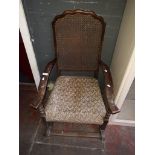 A 1930's bergere back rocking chair