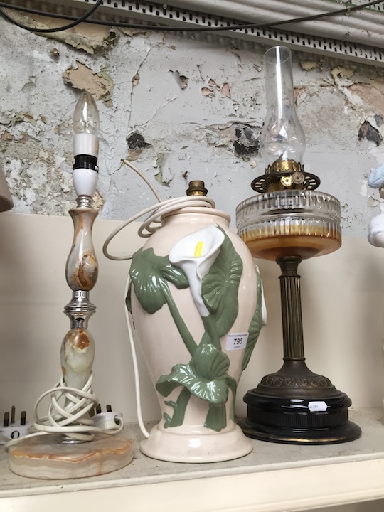 Three lamps, including onyx style table lamp and brass oil lamp with funnel