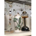 Three lamps, including onyx style table lamp and brass oil lamp with funnel