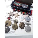 A quantity of medals including a WWI pair 39698 PTE W DERHAM LAN FUS, a WWII group of four (later