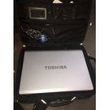 A 17" Toshiba Equium L350 10L laptop in case.