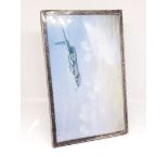 A hallmarked silver mounted photo frame, 14cm x 9cm.