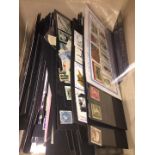 A box of world stamps and black cards