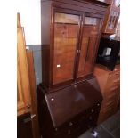 A mahogany glazed bureau bookcase