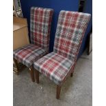 A pair of chequered pattern high back dining chairs