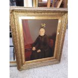 A portrait painted over photographic print in gilt frame