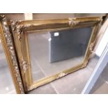 An ornate gilt framed mirror