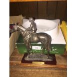 A Nijinsky metal figure depicting jockey on horse, with certificate and box along with a Whiskas