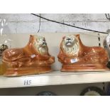 A pair of Staffordshire ceramic lions