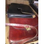 A box of leather satchels and briefcases