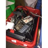 A box of electronical testing equipment, house phones, etc.