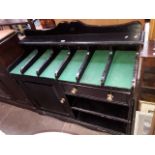 An ebonised kitchen sideboard