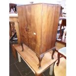 A walnut record cabinet