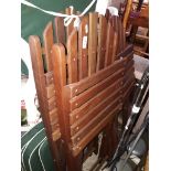 A set of 4 teak patio chairs with cushion sets