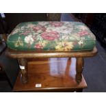 An ash footstool with upholstered top.